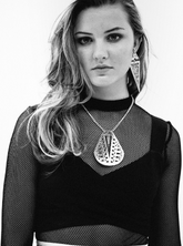 Geometric triangular drop earrings with gold finish.